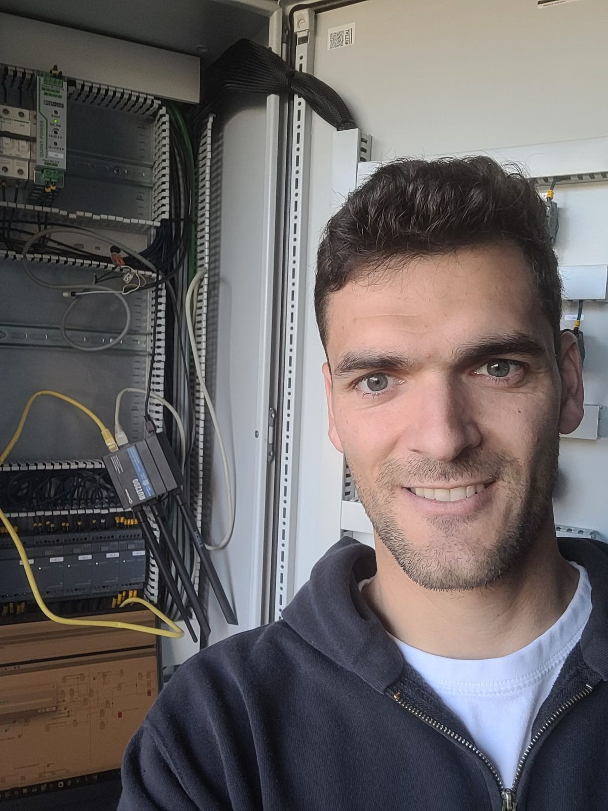 Bart in front of an electrical cabinet